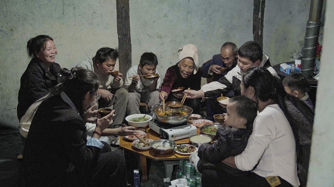 A multigenerational family sharing a meal together